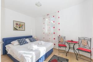 Postel nebo postele na pokoji v ubytování Apartments and Room Excelsior