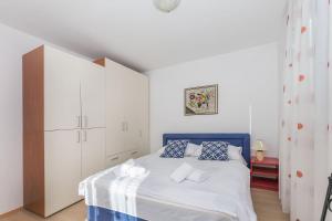 Postel nebo postele na pokoji v ubytování Apartments and Room Excelsior