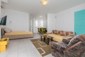 Posezení v ubytování Apartments and Room Excelsior