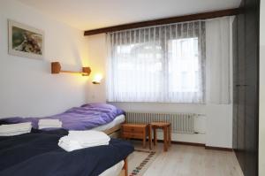 Postel nebo postele na pokoji v ubytování Alpenhaus Bettmeralp
