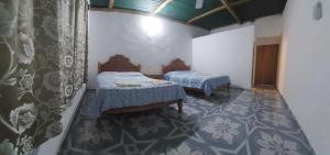 Giường trong phòng chung tại Cabaña Sak Ja Selva Lacandona