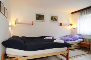 Postel nebo postele na pokoji v ubytování Alpenhaus Bettmeralp