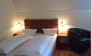 Postel nebo postele na pokoji v ubytování Hotel Kaiserhof am Dom
