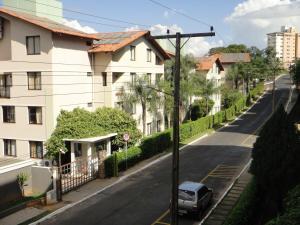 a car parked on the side of a street with buildings at Hot Park - 400 metros in Rio Quente