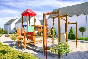 a playground in front of a building at Apartment in Rogowo near Baltic Sea Beach in Rogowo