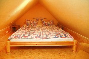 a bedroom with a bed in a attic at Apartment, Parmen near Feldberg in Parmen