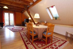 a dining room with a table and chairs at Apartment, Parmen near Feldberg in Parmen