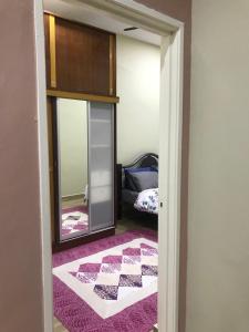 Postel nebo postele na pokoji v ubytování Homestay Islam Bandar Tasik Puteri Rawang