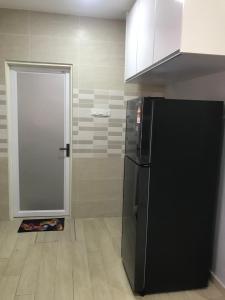 Kuchyň nebo kuchyňský kout v ubytování Homestay Islam Bandar Tasik Puteri Rawang
