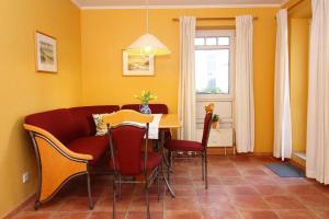 a dining room with a table and chairs at Apartment Villa Sonja, Zingst in Zingst