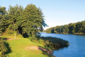 a view of a river with trees on the shore at House, Parmen near Feldberg in Parmen