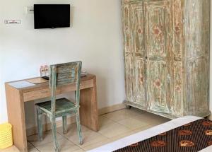 TV a/nebo společenská místnost v ubytování Chendana Homestay Bali