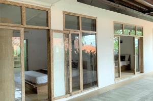 Postel nebo postele na pokoji v ubytování Chendana Homestay Bali