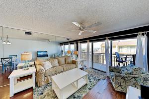 a living room with a couch and a table at Surfcaster Unit 401 in Ocean City