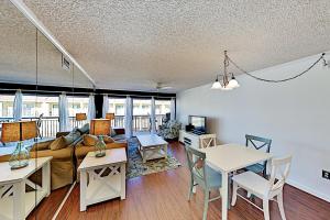 a living room with a couch and a table at Surfcaster Unit 401 in Ocean City