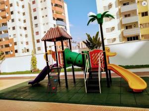 a playground in a apartment with a slide at Riviera Park Caldas Novas in Caldas Novas