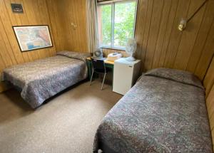 Postel nebo postele na pokoji v ubytování Denali RV Park & Motel