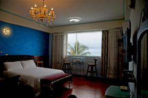 Ένα ή περισσότερα κρεβάτια σε δωμάτιο στο HL Sea Homestay