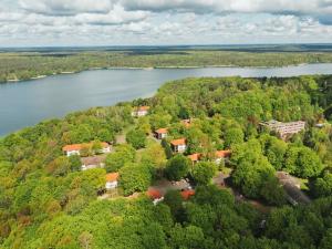 an aerial view of a house next to a river at seezeit-resort am Werbellinsee in Joachimsthal