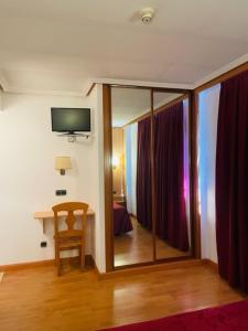 TV a/nebo společenská místnost v ubytování Hotel VillaPaloma