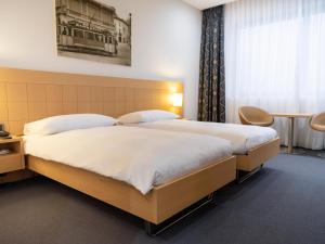 Postel nebo postele na pokoji v ubytování Hotel Coronado