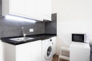 A kitchen or kitchenette at Home2Book Sea View Studio Puerto de la Cruz