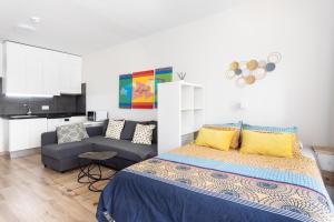 A bed or beds in a room at Home2Book Sea View Studio Puerto de la Cruz
