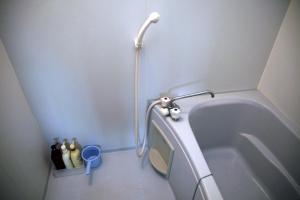 a bathroom with a bath tub with a toilet at Crane / Vacation STAY 564 in Kunisaki