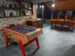 a foosball table in the middle of a room at Magic Borda Cremat HUT4-5018 in La Massana