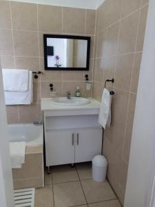 a bathroom with a sink and a mirror at Innes Road Durban Accommodation Private Double Room with Private Bathroom in Durban +15 photos