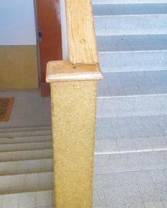 a wooden pole on the side of a stairs at Paris 12mn, Orly 10mn Superbe chambre privée in Juvisy-sur-Orge