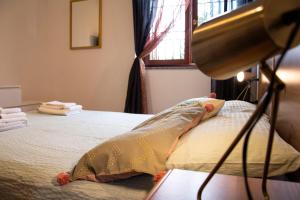 Ein Bett oder Betten in einem Zimmer der Unterkunft Un’oasi di pace