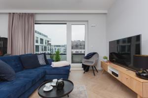 Televízia a/alebo spoločenská miestnosť v ubytovaní Mokotów Apartment LUX with Parking by Renters Prestige
