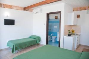 Postel nebo postele na pokoji v ubytování Tenuta Le Casette