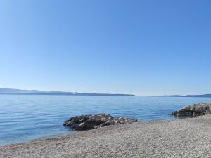 a beach with some rocks in the water at Apartment Diocletians Split Center in Split