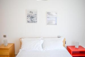 Giường trong phòng chung tại Homiday - Bordopineta Residence