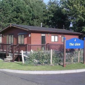 a small house with a sign in front of it at No 1 The Glen in Port Seton