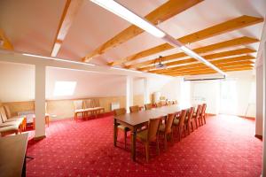 a conference room with a long table and chairs at Villa Hotel Theresa in Rakvere