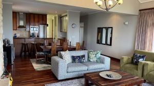 a living room with a couch and a table at World's View Knysna in Knysna
