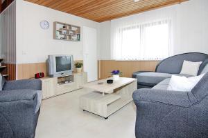 a living room with two chairs and a tv at House, Tessmannsdorf in Teßmannsdorf