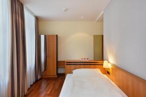 Apart Hotel Amadeo客房内的一张或多张床位