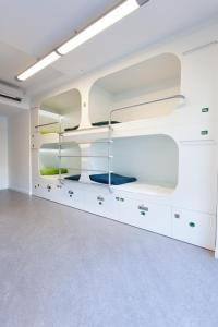 a kitchen with a sink and a refrigerator at Dream Cube Hostel in Barcelona