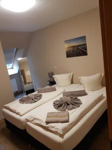 Säng eller sängar i ett rum på Ferienanlage Müritz Seeromantik