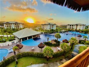 a view of a pool at a resort at VG SUN Apartamento com vista para o mar - High speed internet in Caucaia