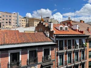 a group of buildings with red tile roofs at Edificio Leganitos in Madrid
