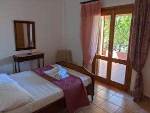 Postel nebo postele na pokoji v ubytování House of Polymnia