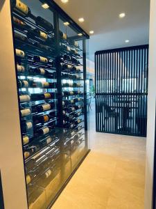 a wine cellar with a wall of wine bottles at Hotel VIU57 in Mellieħa