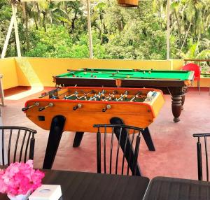two pool tables in a room with a pool table at Swarg 5Bhk Villa Alibaug in Alibaug