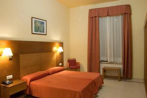 Voodi või voodid majutusasutuse Gran Hotel Balneario toas