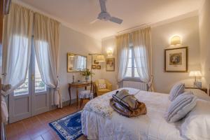 a bedroom with a bed with a purse on it at Casa Bellavista B&B in Cortona